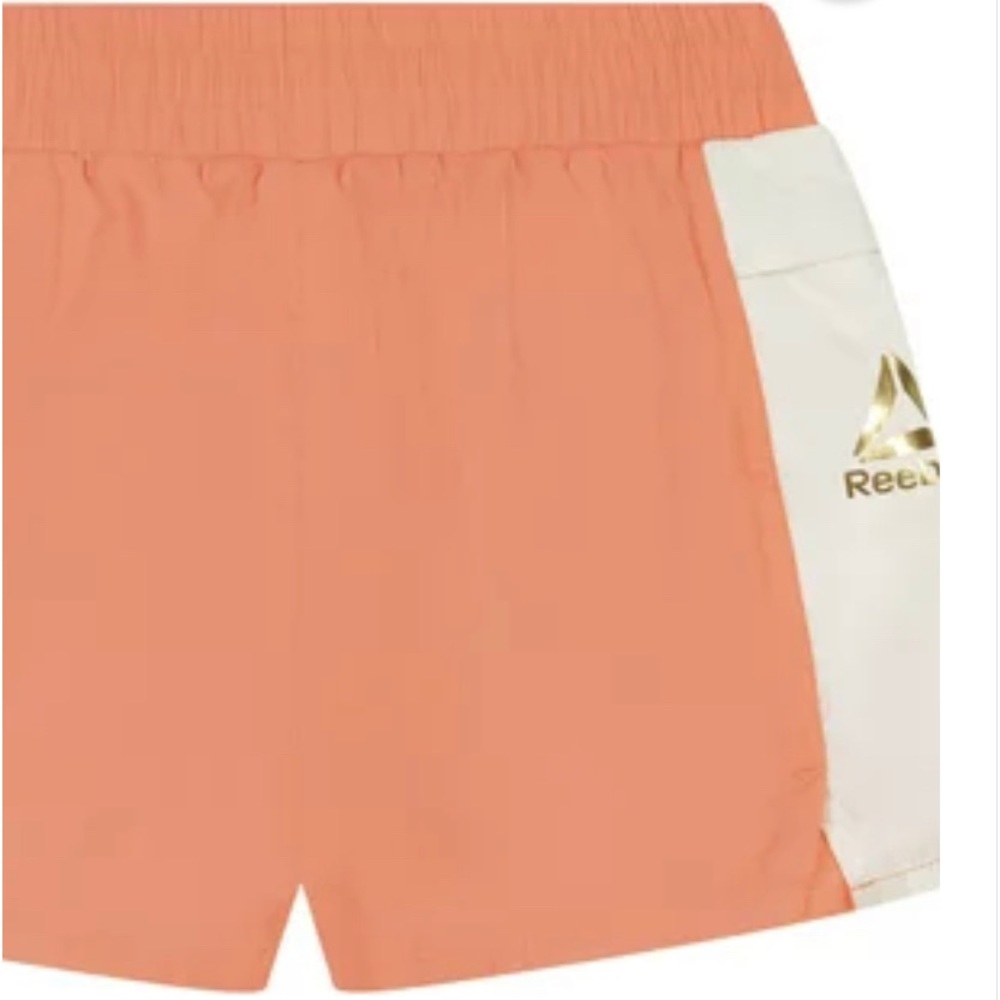 NWOT Reebok Shorts in Papaya Pink NWOT only tried on but were too small for her.